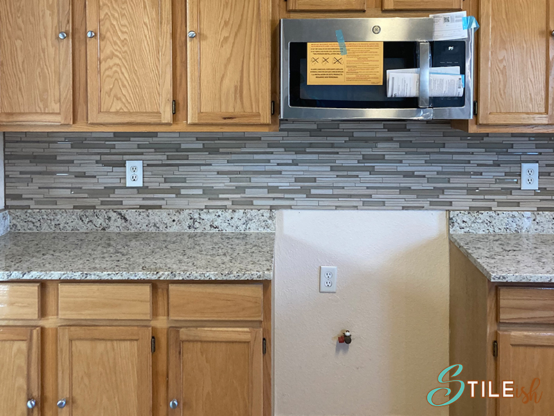 glass and travertine backsplash